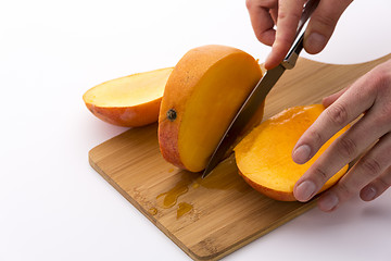 Image showing Last Third Of A Mango Cut Off Along Its Fruit Pit