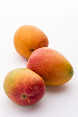 Image showing Three Ripe Mangos, Mangifera indica, On White