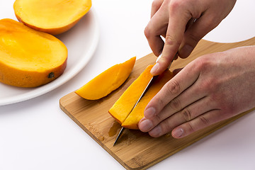 Image showing Second Cut Through One Third Of A Trisected Mango
