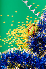 Image showing Christmas card. Stars and Christmas decorations on a green