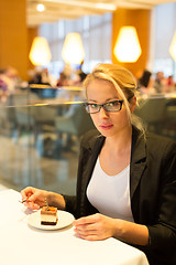 Image showing Women eating dessert in fancy restaurant.