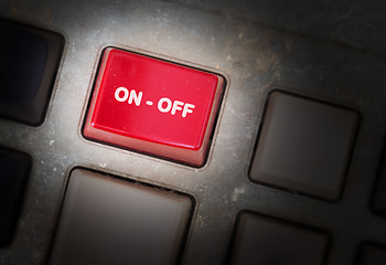 Image showing Red button on a dirty old panel