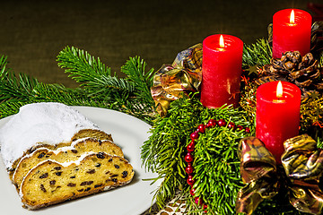 Image showing Christmas stollen bakery with Advent wreath with burning candles