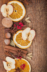 Image showing Christmas spices and dried orange sliceson 