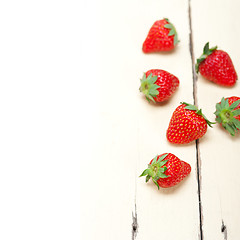 Image showing fresh organic strawberry over white wood