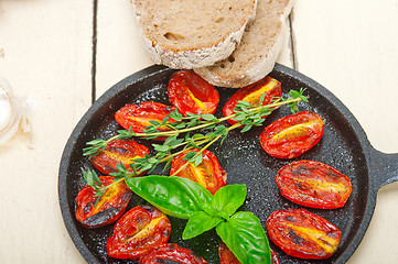 Image showing baked cherry tomatoes with basil and thyme