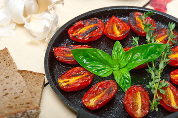 Image showing baked cherry tomatoes with basil and thyme