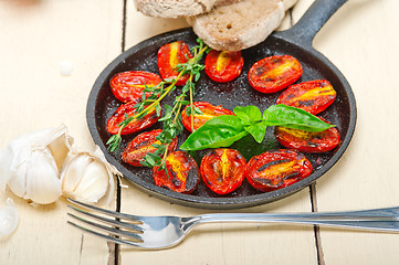 Image showing baked cherry tomatoes with basil and thyme