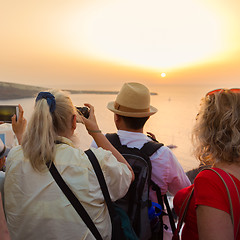 Image showing Trvellers watching sunset in Oia, Santorini, Greece.