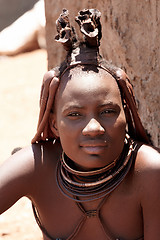 Image showing Himba woman with ornaments on the neck in the village