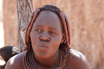 Image showing Himba woman with ornaments on the neck in the village