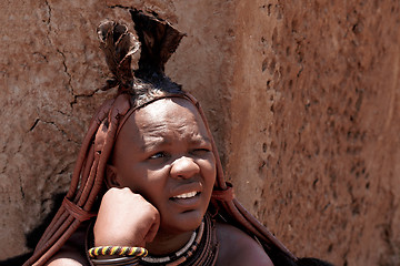 Image showing Himba woman with ornaments on the neck in the village