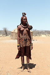 Image showing Himba woman with ornaments on the neck in the village