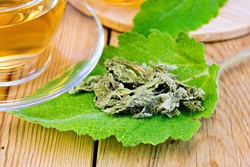 Image showing Sage dried on fresh leaf with cup on board