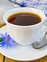 Image showing Chicory drink in white cup with milkman and flower on board