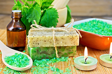 Image showing Soap homemade and salt with nettles in mortar on board