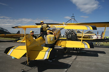 Image showing Crew preparing stunt plane for performance