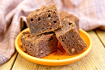 Image showing Pie chocolate in clay plate on board