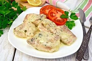 Image showing Fish stew in creamy sauce with tomatoes in plate