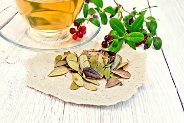 Image showing Lingonberry leaf on paper with cup