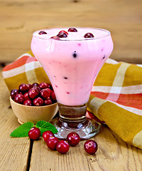 Image showing Yogurt thick with cranberries and mint on board