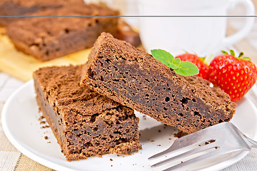 Image showing Pie chocolate with strawberries in plate on napkin