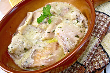 Image showing Fish stew in creamy sauce on ceramic pan