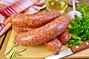 Image showing Sausages beef on board with knife