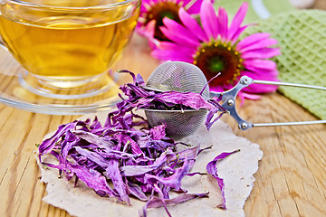 Image showing Echinacea dried on paper in strainer with flowers