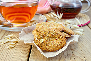 Image showing Cookies oatmeal with spikelet and napkin on board