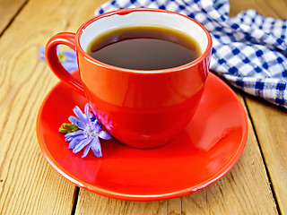 Image showing Chicory drink in red cup with napkin and flower on board