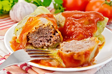 Image showing Cabbage stuffed with tomato sauce on light board