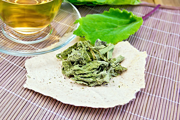 Image showing Sage dried on paper with cup on board