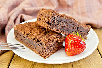 Image showing Pie chocolate with strawberries in plate on board