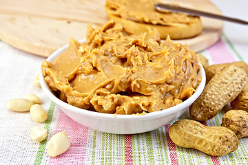 Image showing Butter peanut in the bowl on tablecloth