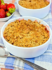 Image showing Crumble strawberry on blue napkin with berries