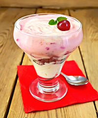 Image showing Dessert milk with cherry on red napkin