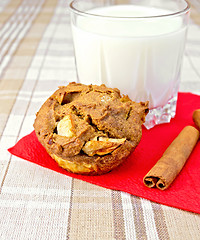 Image showing Cupcake rye with apples on paper napkin with milk