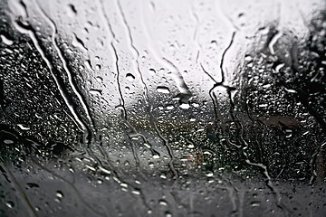 Image showing Raindrops with the gray car