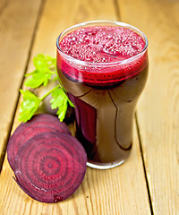 Image showing Juice beet in glass on board