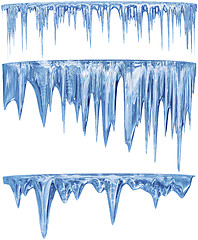 Image showing set of hanging thawing icicles of a blue shade