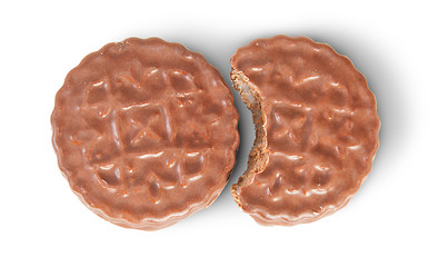 Image showing Whole And Bitten Off Chocolate Cookies Lying Next