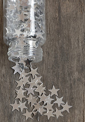 Image showing silver stars for christmas on a old wooden background