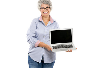 Image showing Elderly woman showing something on a laptop