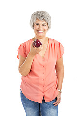 Image showing Old woman eating an apple