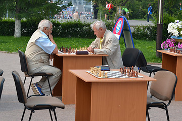 Image showing Chess tournament on the street in the summer.
