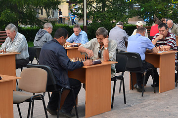 Image showing Chess tournament on the street in the summer.