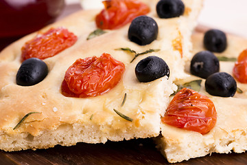 Image showing Focaccia with black olives, tomatoes and basil