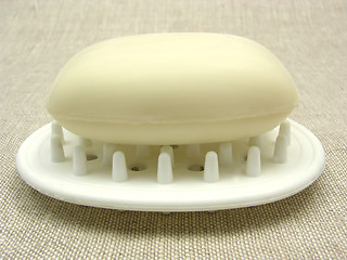 Image showing Beige soap on a soap dish on a beige background