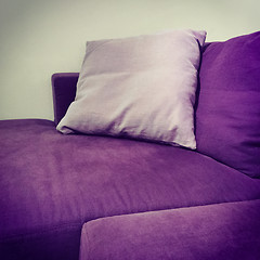 Image showing Purple velvet sofa with cushions